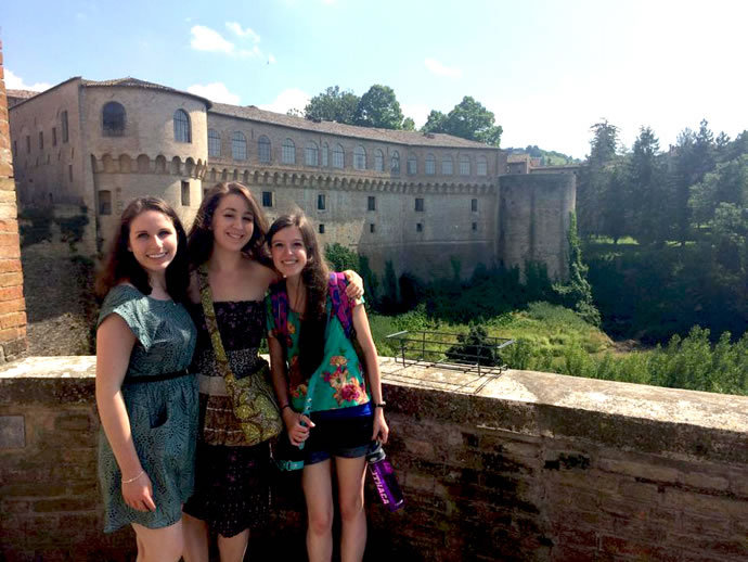 Jessica Newman, Addie Rose Brown, and Leanne Averill in front of Urbania's majestic Palazzo Ducale.